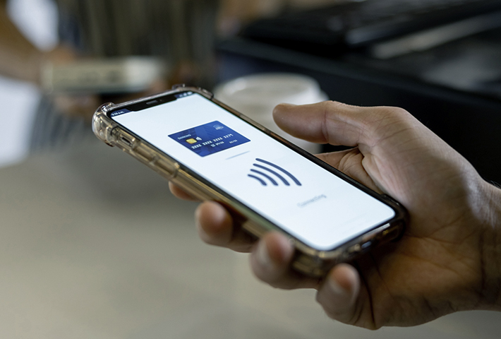 Person using digital wallet to pay.
