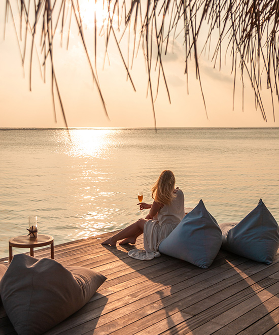 Person watching sunset on vacation.