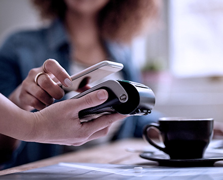 Mobile wallet tapping to pay.