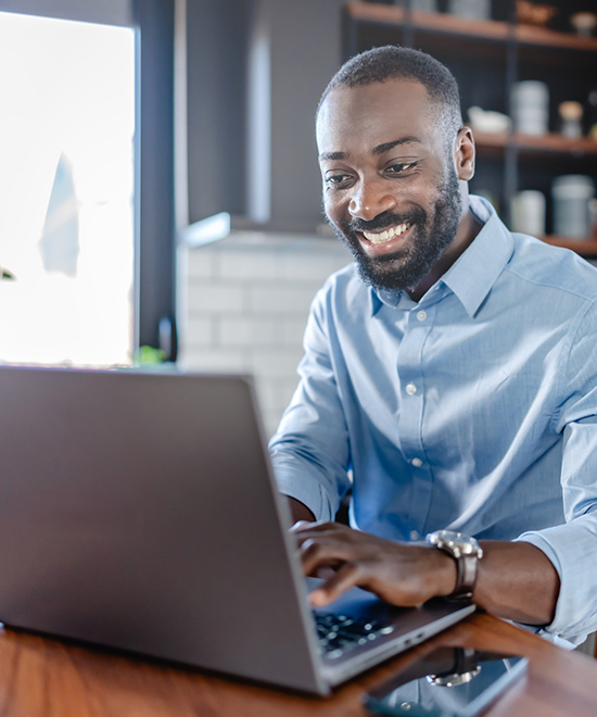 Person paying bills on laptop.